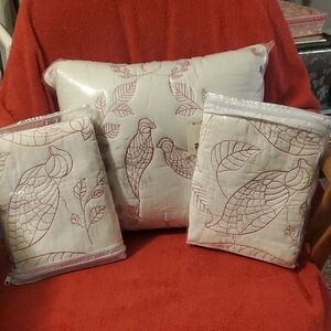 Set of white quilted pillow shams with a redwork bird and leaf embroid pillow